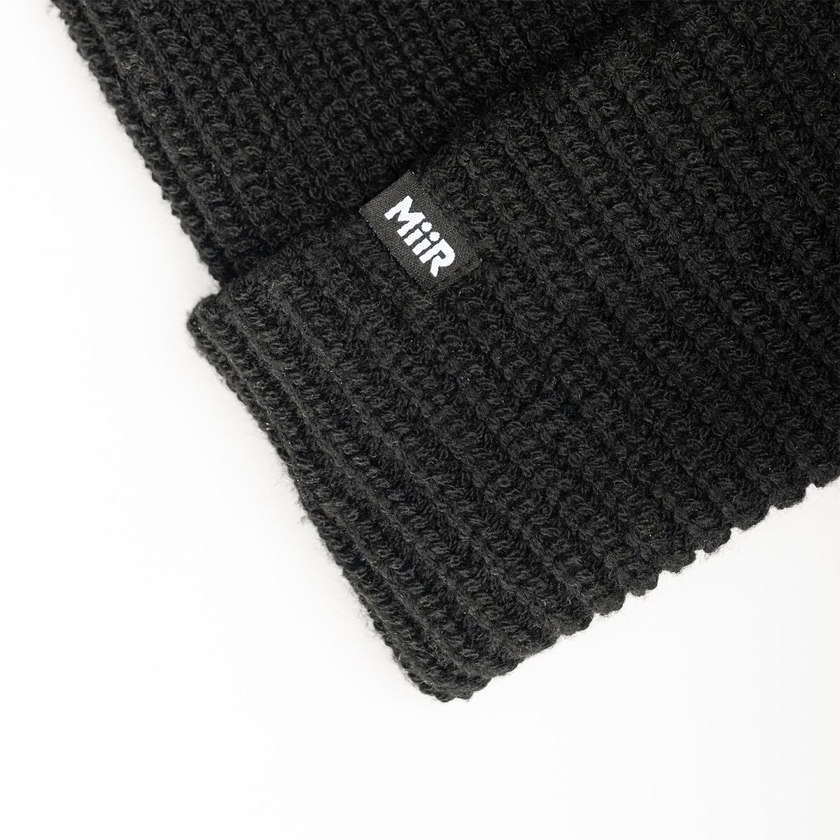 recycled-poly-rib-beanie-y4 WebPDP-RecycledPolyRibBeanie_Studio_TagDetail_Black__BNE002002OS.jpg